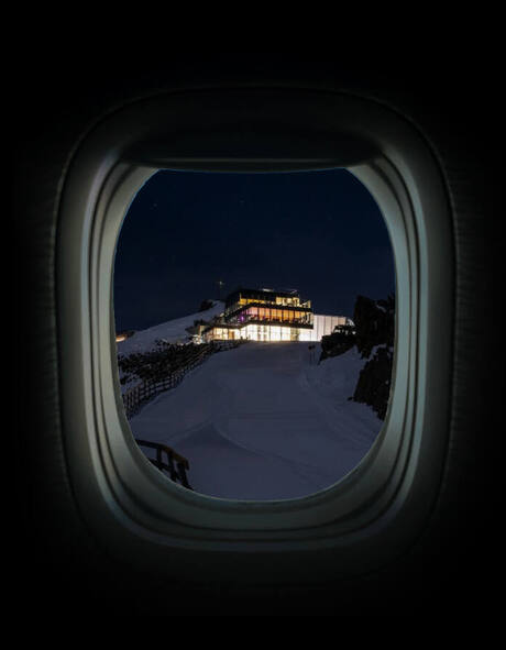 View through an aeroplane window of ice Q at night