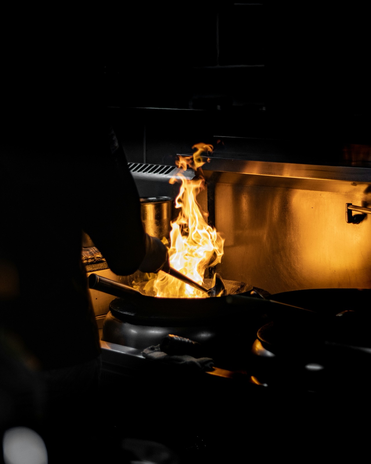 Flames rising from a pan in the kitchen